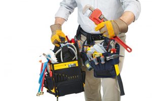 Mature contractor working. Over white background. Worker